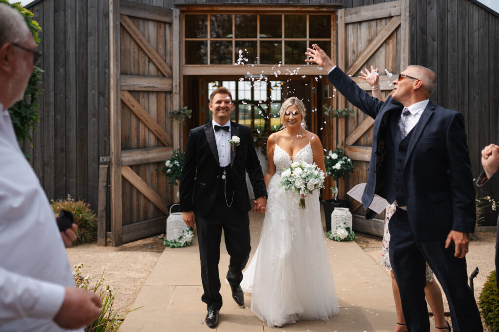 Confetti photos at Hyde House by Cotswolds wedding photographer