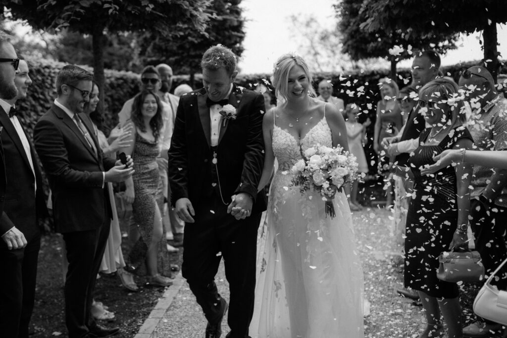 Confetti photos at Hyde House by Cotswolds wedding photographer