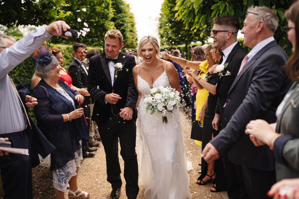 Confetti photos at Hyde House by Cotswolds wedding photographer