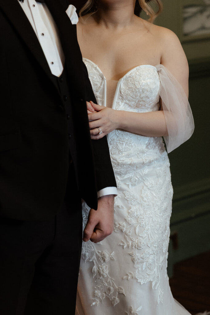 Couple drinking cocktails by the fire at Elcott Park for wedding