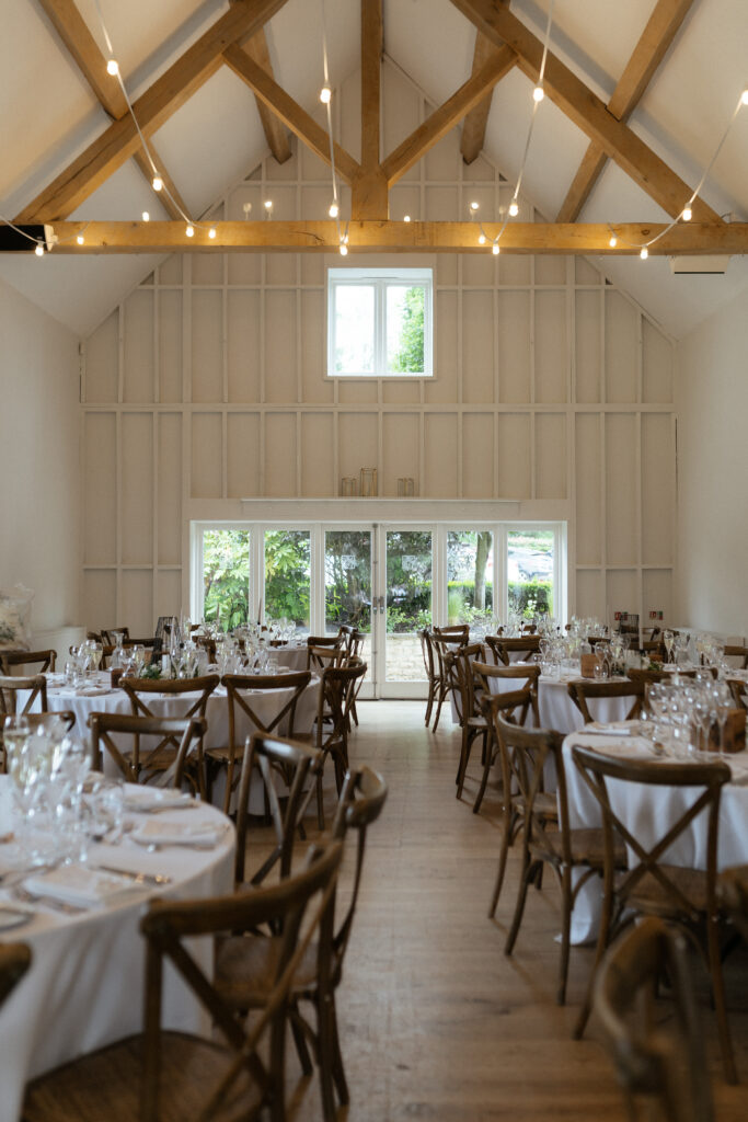 The Barn wedding reception space at hyde house by Cotswolds wedding photographer