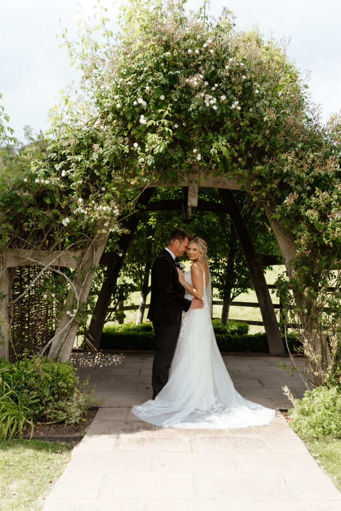 Hyde house 'the arbour' bride and groom portrait by Cotswolds wedding photographer