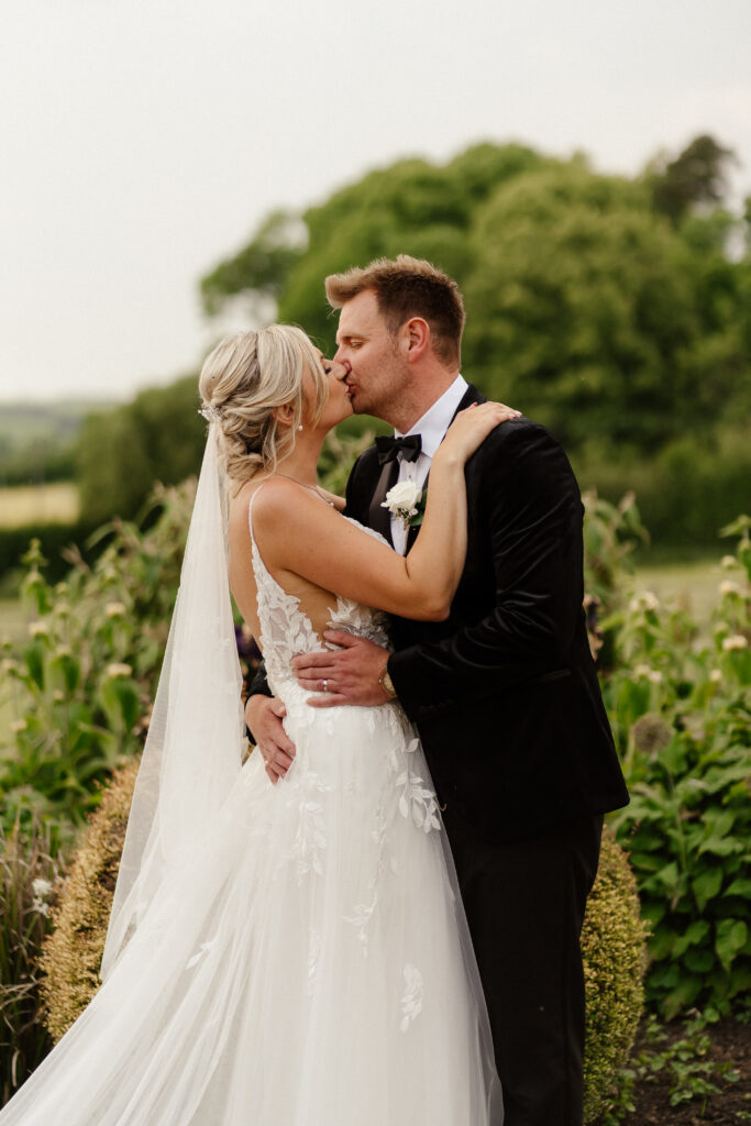 bride and groom at golden hour at hyde house by cotswolds wedding photographer