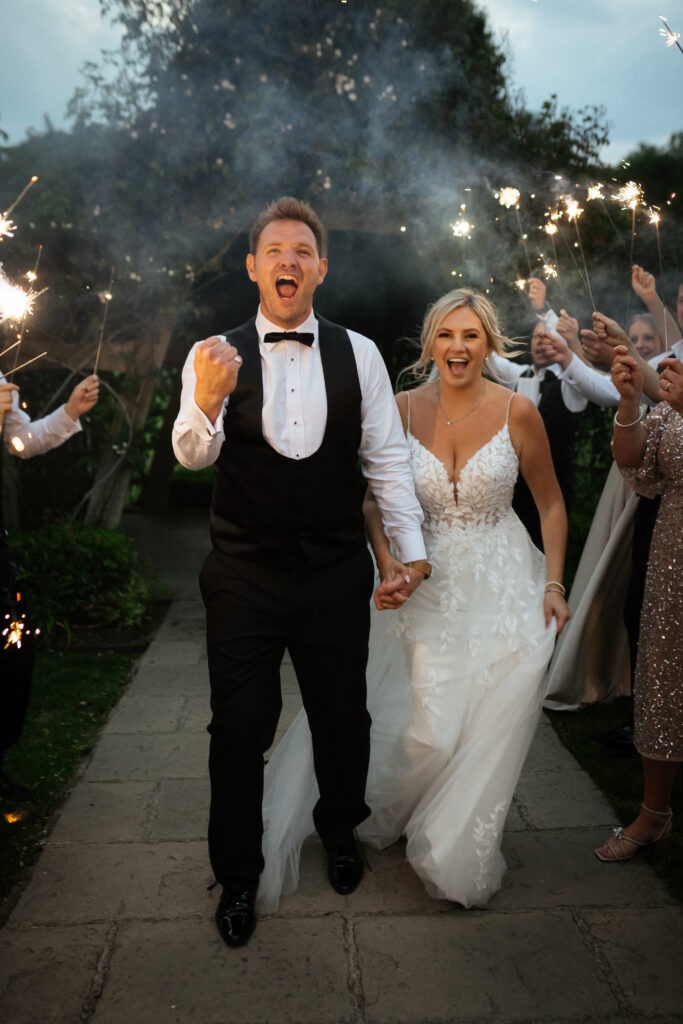 bride and groom during sparklers exit at hyde house by cotswolds wedding photographer