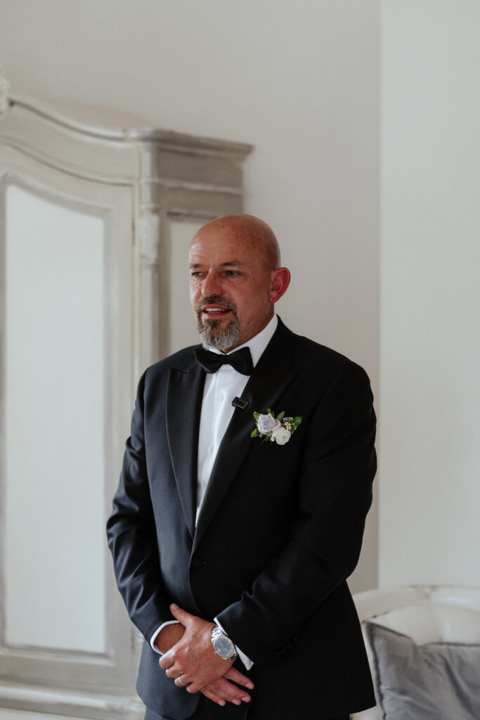 Manor by the Lake bridal party father of the bride reveal by Cotswolds wedding photographer