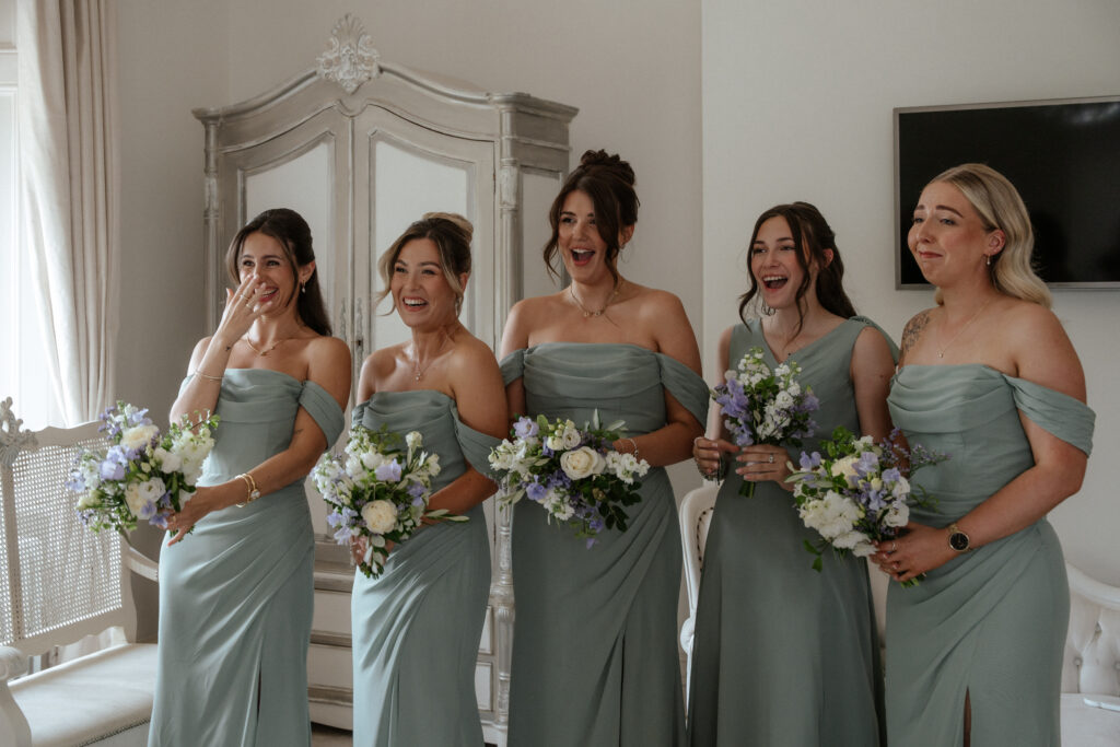 Manor by the Lake bridal party dress reveal by Cotswolds wedding photographer
