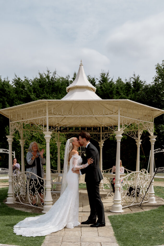 Manor by the Lake outdoor ceremony photos by Cotswolds wedding photographer