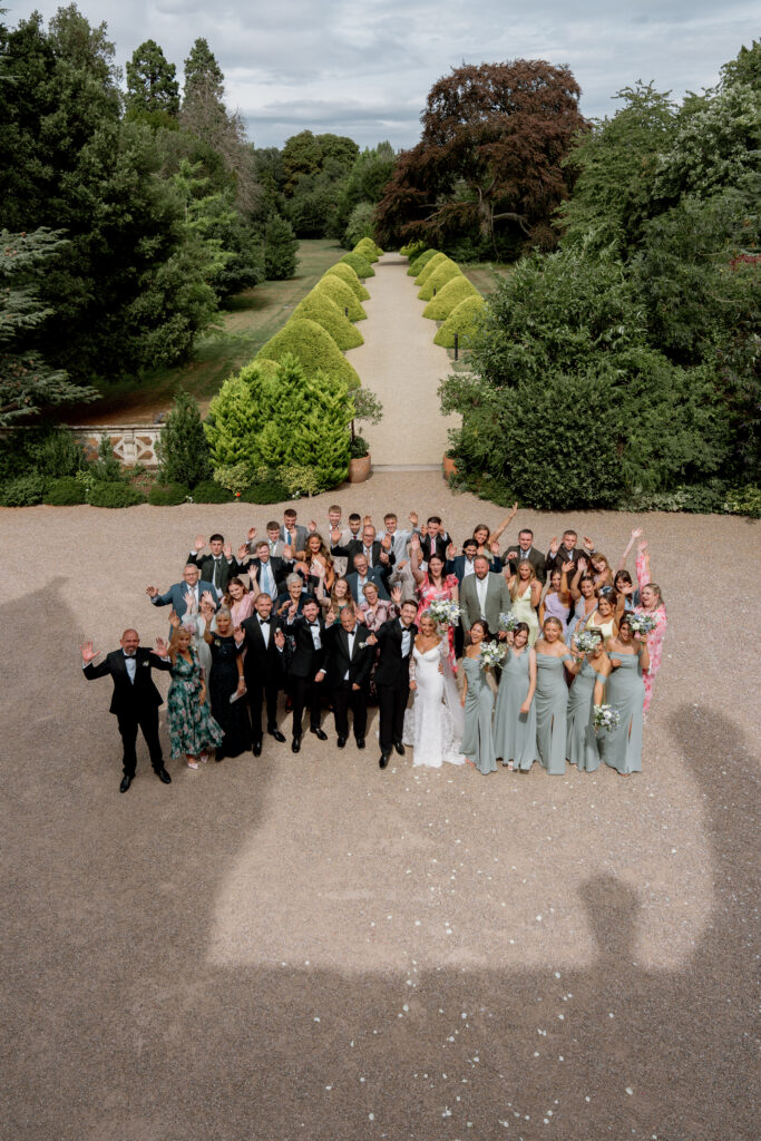 Manor by the Lake group photo by Cotswolds wedding photographer