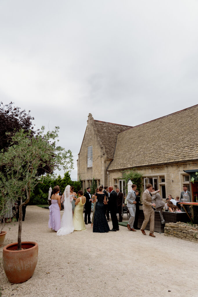 Manor by the Lake cocktail hour photos by Cotswolds wedding photographer