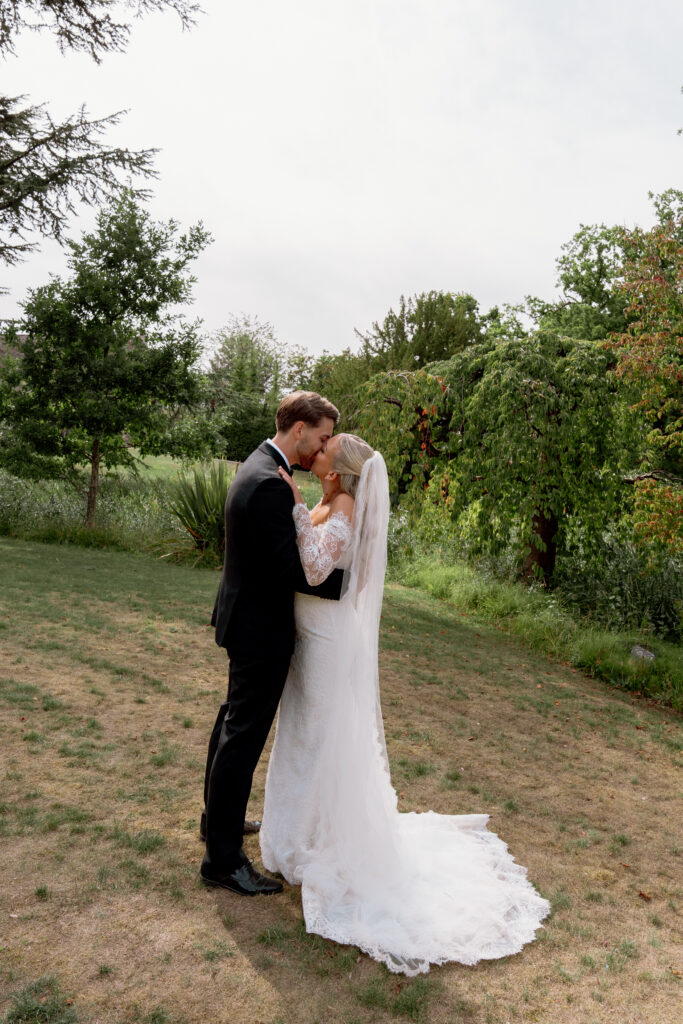 Manor by the Lake bride and groom couple photos by Cotswolds wedding photographer