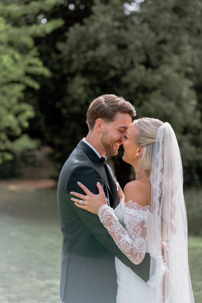 Manor by the Lake bride and groom couple photos by Cotswolds wedding photographer