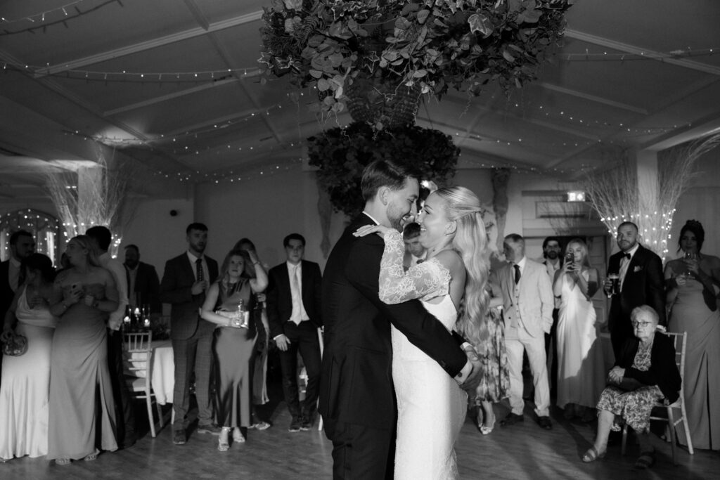 Manor by the Lake bride and groom at first dance by Cotswolds wedding photographer