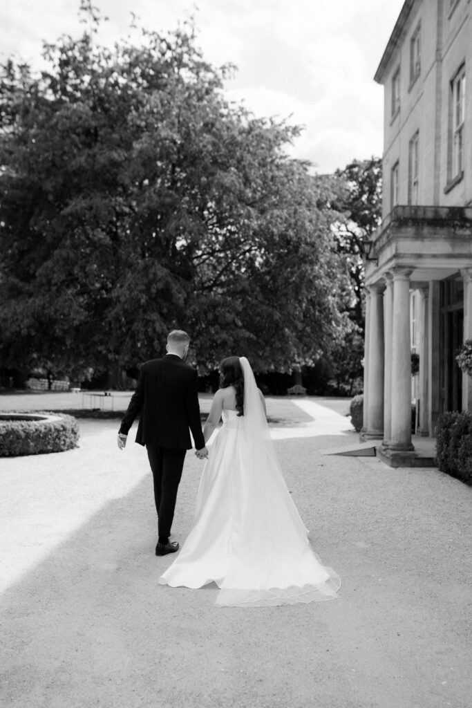 bride and groom at Eastington Park during couple portraits by Cotswolds wedding photographer