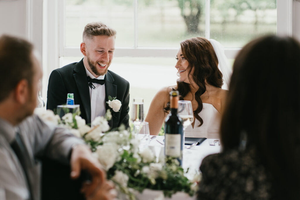 The ballroom at Eastington Park during speeches by Cotswolds wedding photographer