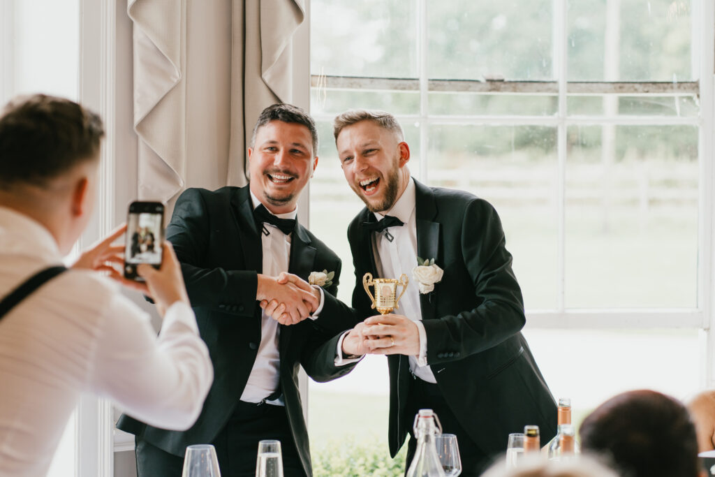 The ballroom at Eastington Park during speeches by Cotswolds wedding photographer