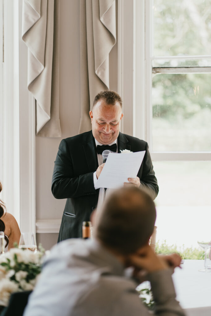 The ballroom at Eastington Park during speeches by Cotswolds wedding photographer