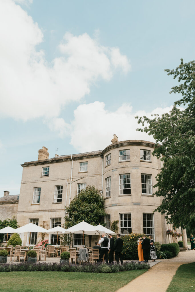 guests during cocktail hour at Eastington Park by Cotswolds wedding photographer