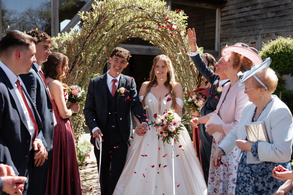 Bride and Groom at Barns & Yard for willow arch confetti photo