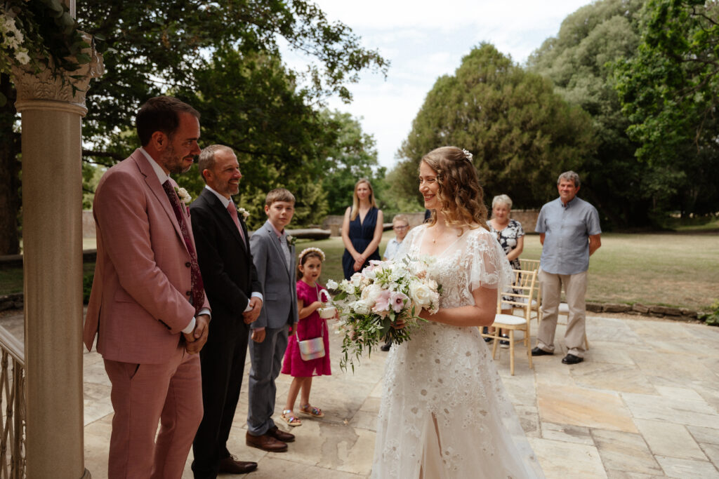 outdoor ceremony at Eastington park by Cotswolds wedding photographer