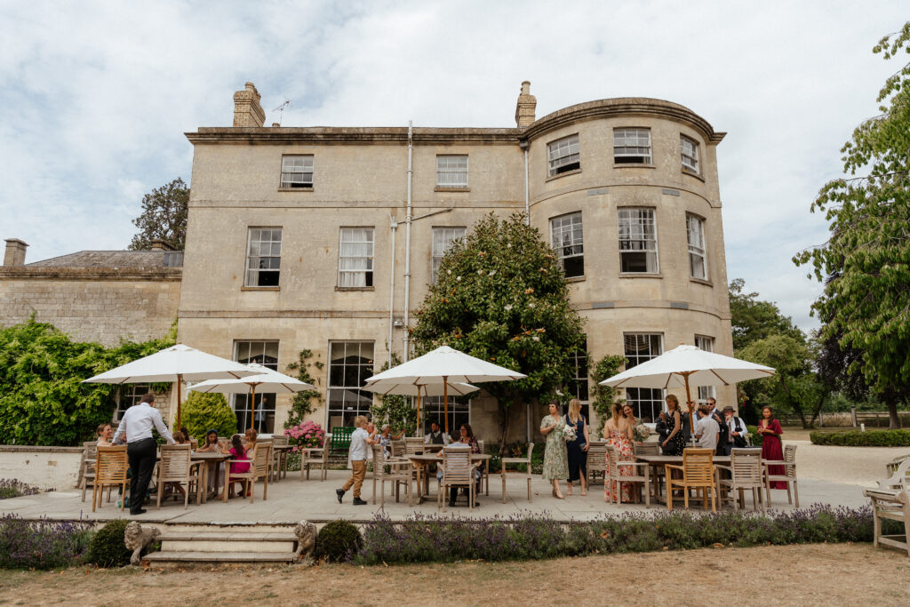 Photo of guests at Eastington Park wedding by Cotswolds wedding photographer