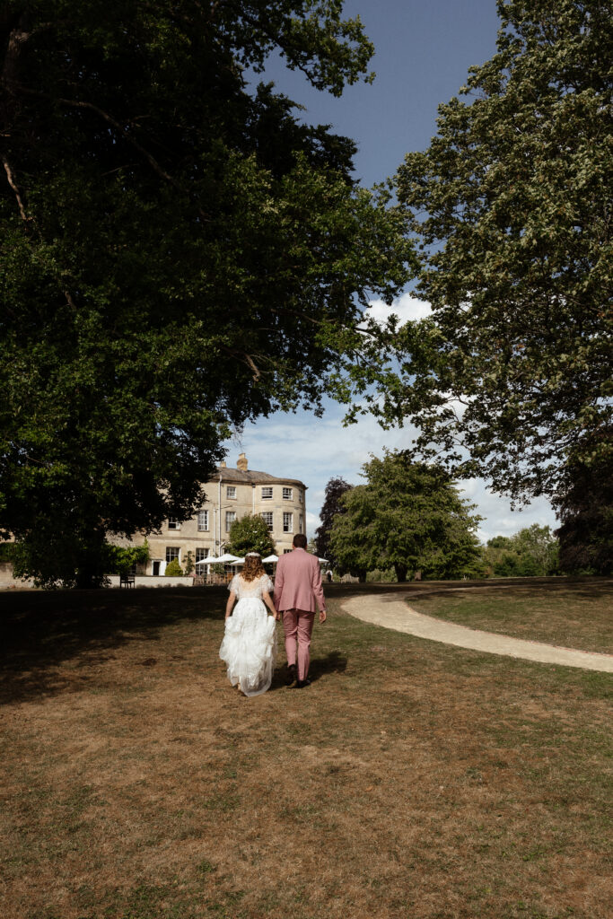 couple portraits at eastington park  by cotswolds wedding photographer