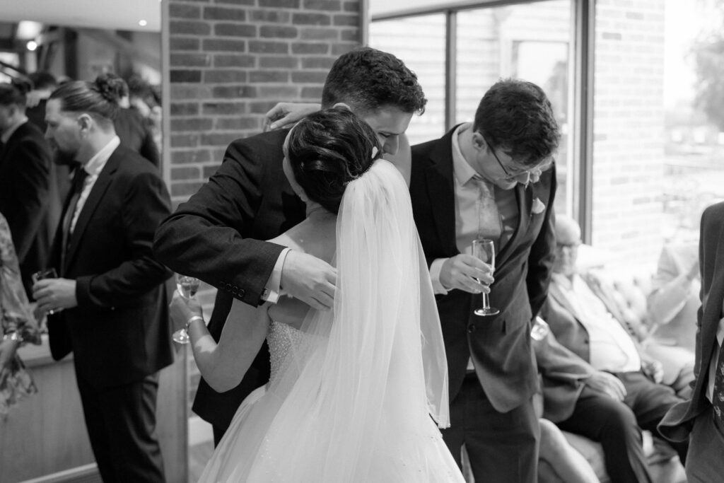 Cocktail hour candid photos at Bredenbury Court Barns by Hereford Wedding Photographer