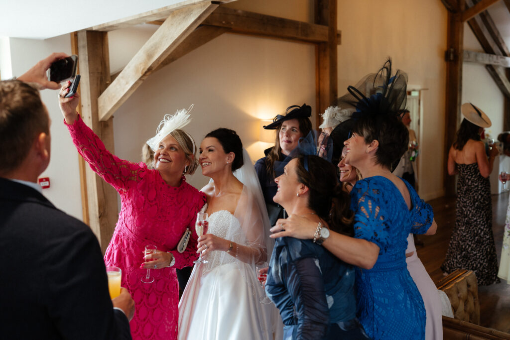 Cocktail hour candid photos at Bredenbury Court Barns by Hereford Wedding Photographer