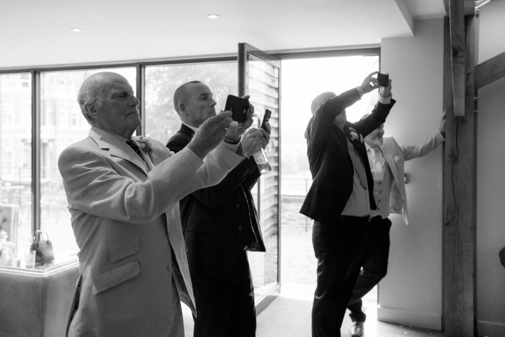 Cocktail hour candid photos at Bredenbury Court Barns by Hereford Wedding Photographer