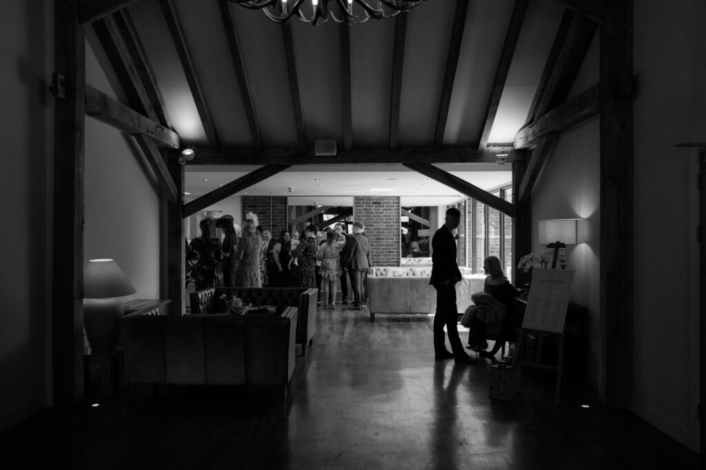 Cocktail hour candid photos at Bredenbury Court Barns by Hereford Wedding Photographer