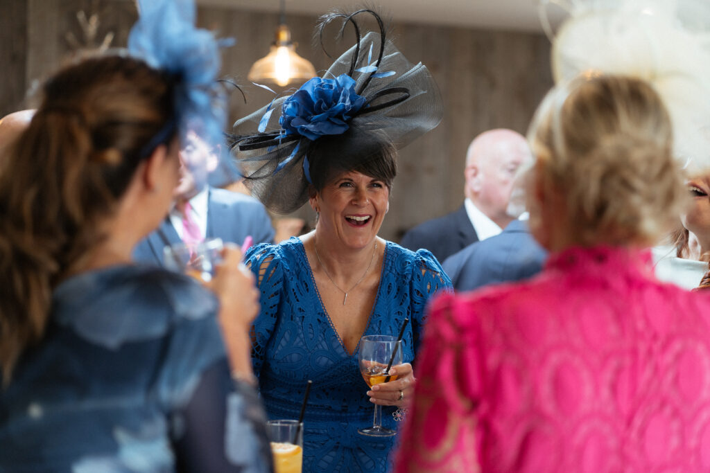 Cocktail hour candid photos at Bredenbury Court Barns by Hereford Wedding Photographer