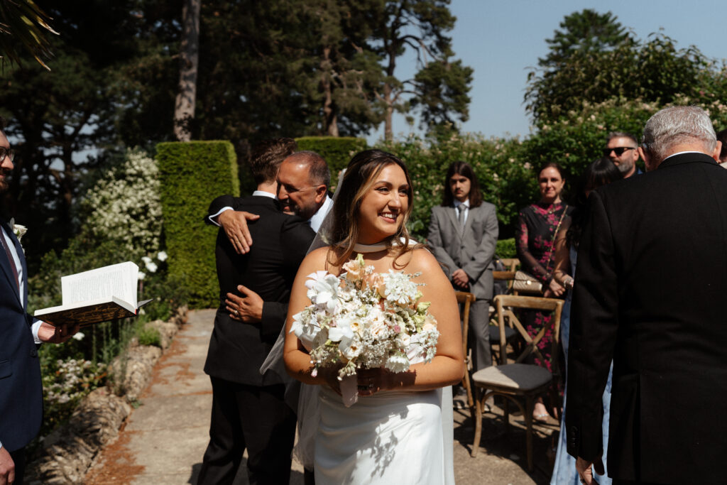 outdoor wedding ceremony at kiftsgate court gardens by cotswolds wedding photographer