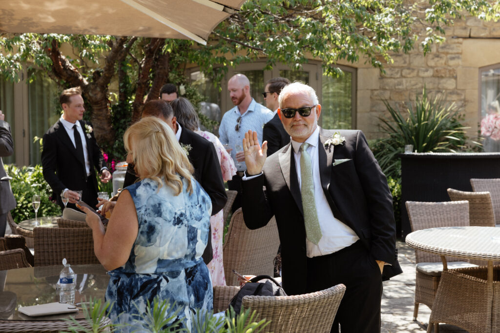 cocktail hour for wedding at manor house hotel by cotswolds wedding photographer