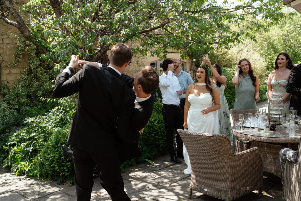 cocktail hour for wedding at manor house hotel by cotswolds wedding photographer