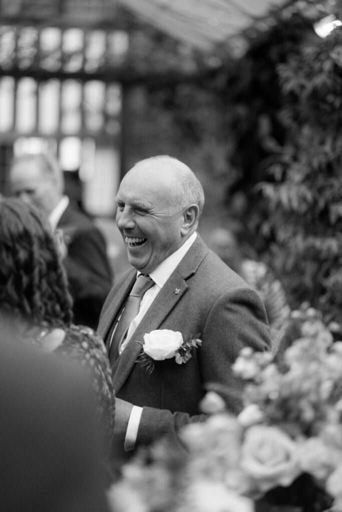 outdoor ceremony under a pergola at brinsop court for autumn wedding by hereford wedding photographer