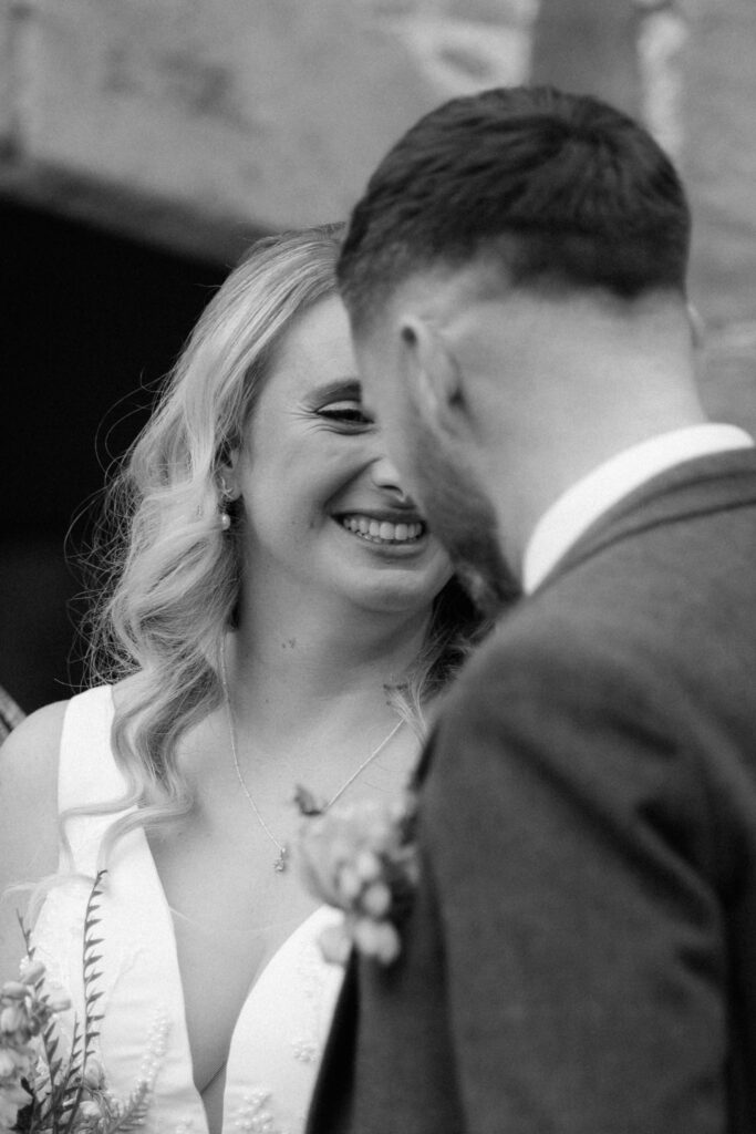 outdoor ceremony under a pergola at brinsop court for autumn wedding by hereford wedding photographer