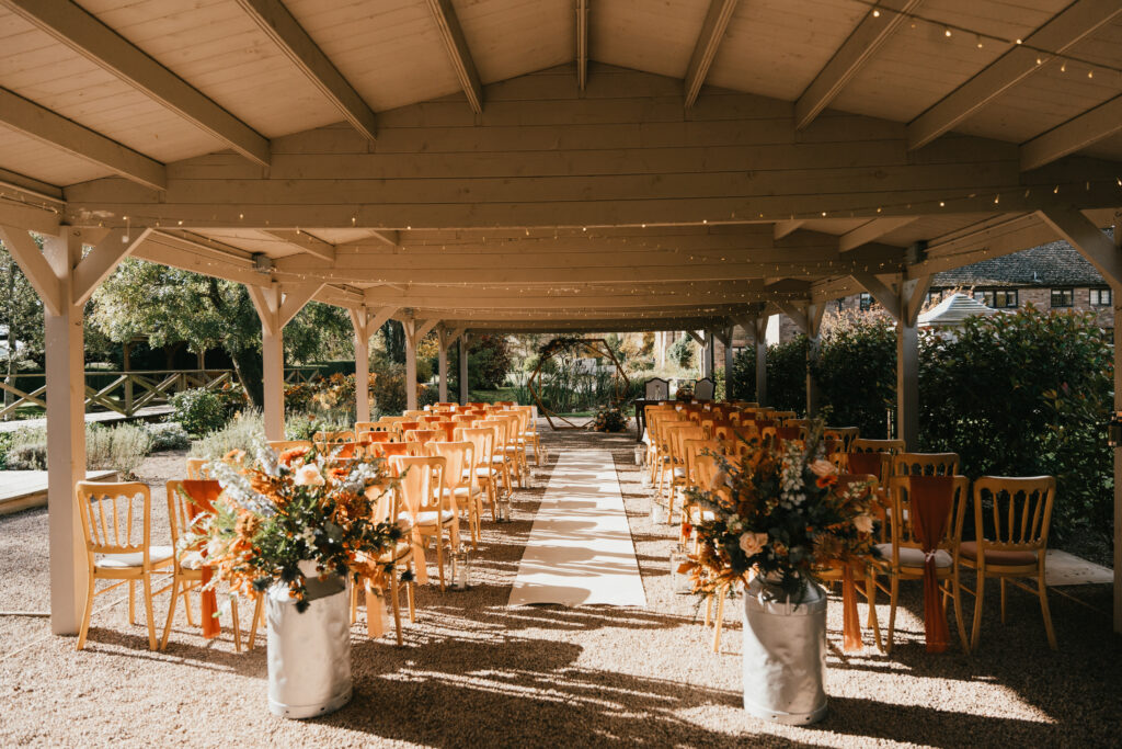 autumn wedding at brinsop court by hereford wedding photographer for outdoor ceremony