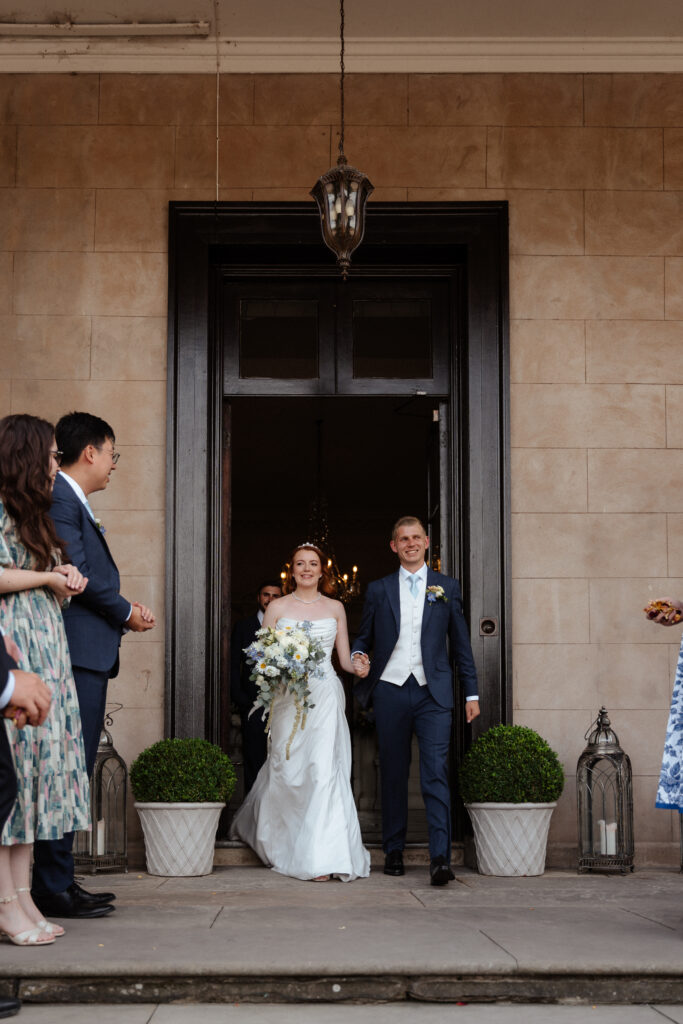 Davenport House wedding photos taken by Cotswolds wedding photographer at confetti photo moment