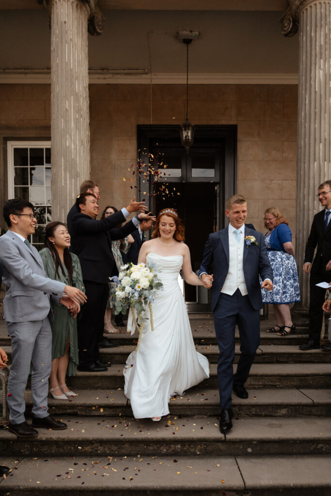 Davenport House wedding photos taken by Cotswolds wedding photographer at confetti photo moment